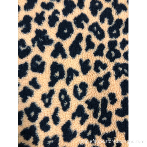 100% polyester sherpa jacquard med leopardmönster